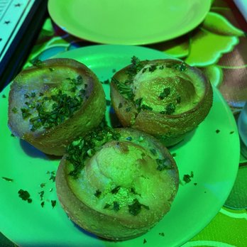 Jacques-Imo's Cafe - Cornbread muffins seen under green light. - Cajun/Creole Near Me - New Orleans, Louisiana Jacques-Imo's Cafe - Cornbread muffins seen under green light. - Cajun/Creole Near Me - New Orleans, Louisiana