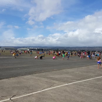 Biggest Little Airshow - Kids picking up candy after the helicopter dropped it from above - Festivals Near Me - Honolulu, Hawaii