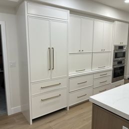Built in fridge, pantry cabinets with appliance garage.