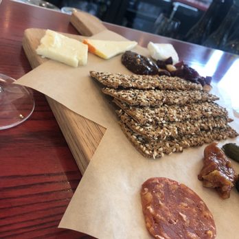 Vino Volo - Crackers mustasa (Spanish for mustard) and a cherry tomato - Wine Bars Near Me - Burlington, Kentucky Vino Volo - Crackers mustasa (Spanish for mustard) and a cherry tomato - Wine Bars Near Me - Burlington, Kentucky