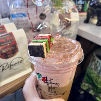 Riposo Coffee Roasters - a hand holding a cup of iced coffee - Coffee Roasteries Near Me - Rumson, New Jersey