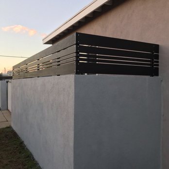 Sermag Construction - Concrete fence with wood top - General Contractors Near Me Sermag Construction - Concrete fence with wood top - General Contractors Near Me