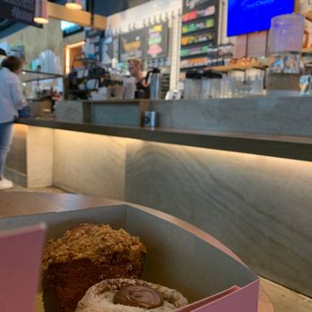 The Coffeehouse at Caroline - Peach Muffin & Nutella Morning Bun with backdrop of coffee bar - Coffee & Tea Near Me - Austin, Texas
