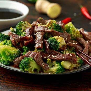 Dragon Bowl - a beef and broccoli dish with chopsticks - Latin American Near Me - San Antonio, Texas Dragon Bowl - a beef and broccoli dish with chopsticks - Latin American Near Me - San Antonio, Texas