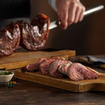 Fogo de Chão - a chef preparing steak - Brazilian Near Me - Emeryville, California Fogo de Chão - a chef preparing steak - Brazilian Near Me - Emeryville, California