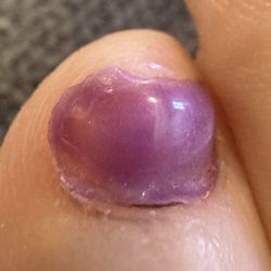 The Nail Spa - Closeup of the polish extending way beyond the nail bed.