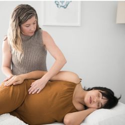 Conceive Wellness Chiropractic and Fertility - Dr Jenny working on a beautiful pregnant mama