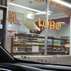 El Lobo - Storefront at night.