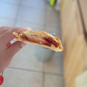 NaVis Bakery - a hand holding a half eaten pastry - Bakeries Near Me - Rosemead, California