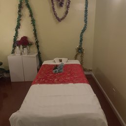 Massage Table with poles above should you need more pressure aka Ashiatsu style of massage.