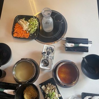 Shikku Hot Pot - Table of broth, proteins, veggies, and fungi. - Hot Pot Near Me - Plymouth, Massachusetts