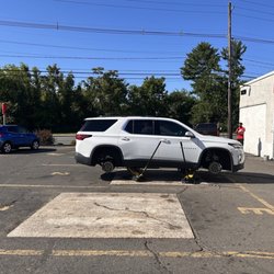 Ruch Tire Inc - Car up on jacks