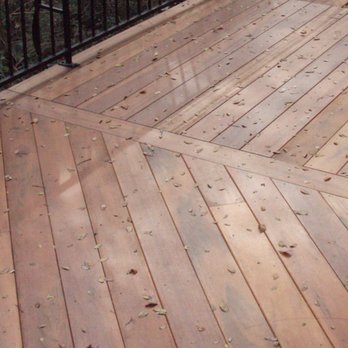 Vision Remodeling - a wooden deck with black iron railings - Painters Near Me - Wimberley, Texas Vision Remodeling - a wooden deck with black iron railings - Painters Near Me - Wimberley, Texas
