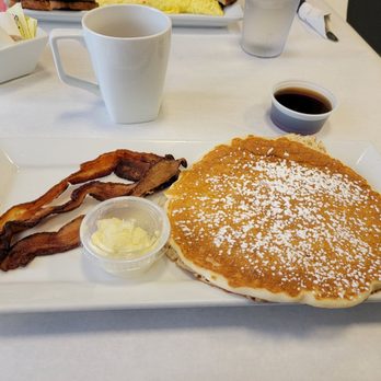 Eggsquisite Eats - Single pancake with a side of bacon - Breakfast & Brunch Near Me - Grand Island, New York