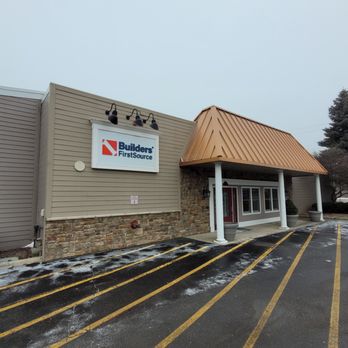 Builders FirstSource - A photo of the Builders FirstSource storefront in Auburn Hills, MI, during winter. The building features light beige siding w... - Building Supplies Near Me - Auburn Hills, Michigan