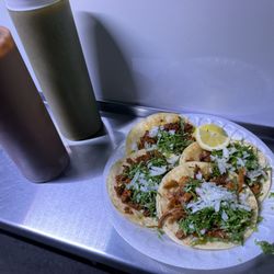 Tacos El Primo - Tacos (al pastor and chorizo) with the red and green salsa