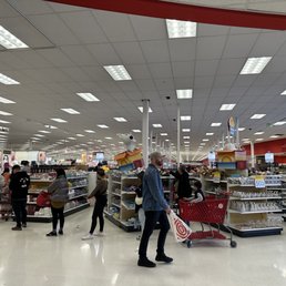 Self check-out wrapped all the way around almost to the exit