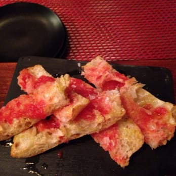 Sensi - Bread rubbed with tomato, olive oil, and garlic.  Pare this with the ham. - Tapas/Small Plates Near Me - Barcelona, B