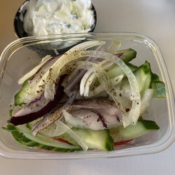 Morena aan de Amstel - Salad with cucumber and tomatoes. Large container of tzaziki. Was delicious. - Greek Near Me - Amsterdam, New Hampshire