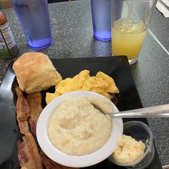 The Blue Hen Cafe - 2 egg breakfast, with scramble eggs, bacon and grits - Southern Near Me - Saint Augustine, Florida