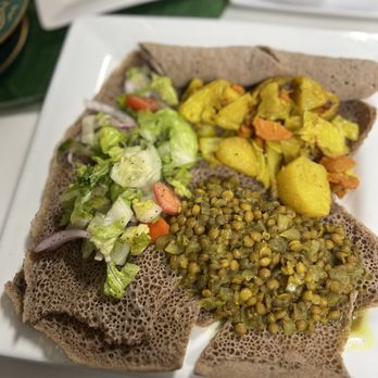 Lulu's EthioVegan Cuisine - Lentils curry potatoes with salad and Gluten Free Injera. Yummmm! - Vegan Near Me - Minneapolis, Minnesota Lulu's EthioVegan Cuisine - Lentils curry potatoes with salad and Gluten Free Injera. Yummmm! - Vegan Near Me - Minneapolis, Minnesota