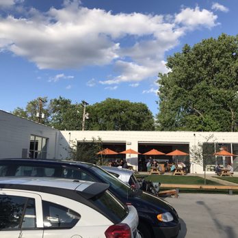 Wild Mind Ales - Busy on this hot evening. The garage doors open to the taproom for ample seating. - Breweries Near Me - Minneapolis, Minnesota Wild Mind Ales - Busy on this hot evening. The garage doors open to the taproom for ample seating. - Breweries Near Me - Minneapolis, Minnesota