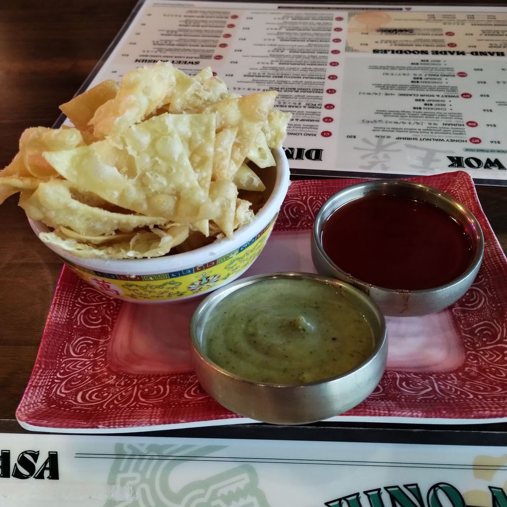 Dragon Casa - On the House fried wonton skins with a Chinese sweet and sour sauce and a Mexican cilantro sauce. - Asian Fusion Near Me - Dallas, Texas