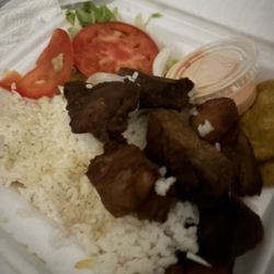 White Rice , Salad , Tomato , Onion , Fried plantains , Fried Turkey Amazing taste