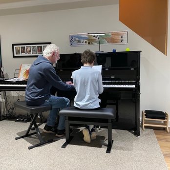 Encore Piano Studio - James and Brian are playing some notes together so that James can see how it all can come together. - Musical Instruments & Teachers Near Me - Roswell, Georgia Encore Piano Studio - James and Brian are playing some notes together so that James can see how it all can come together. - Musical Instruments & Teachers Near Me - Roswell, Georgia
