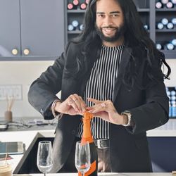 Salon Eros - Stylist Michael-Shayne opening celebratory bottle!