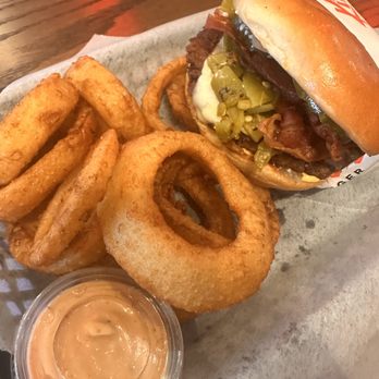 Elite Experience: Killer Burger - Jose Mendoza burger with onion rings and smash sauce - Yelp Events Near Me - Houston, Texas