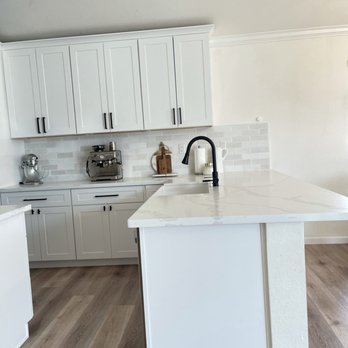 Kinetic Builders - a kitchen with white cabinets and white countertops - General Contractors Near Me - Citrus Heights, California Kinetic Builders - a kitchen with white cabinets and white countertops - General Contractors Near Me - Citrus Heights, California