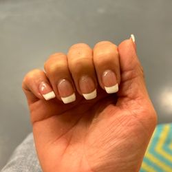 Lovely Nails - Different shapes on all the nails. Clunky and sloppy. Gel all over my skin around the nails.