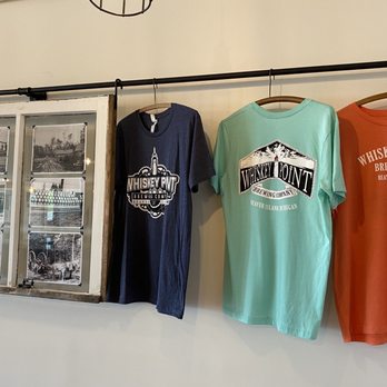 Whiskey Point Brewing - t - shirts hanging on a wall - Breweries Near Me - Beaver Island, Michigan Whiskey Point Brewing - t - shirts hanging on a wall - Breweries Near Me - Beaver Island, Michigan