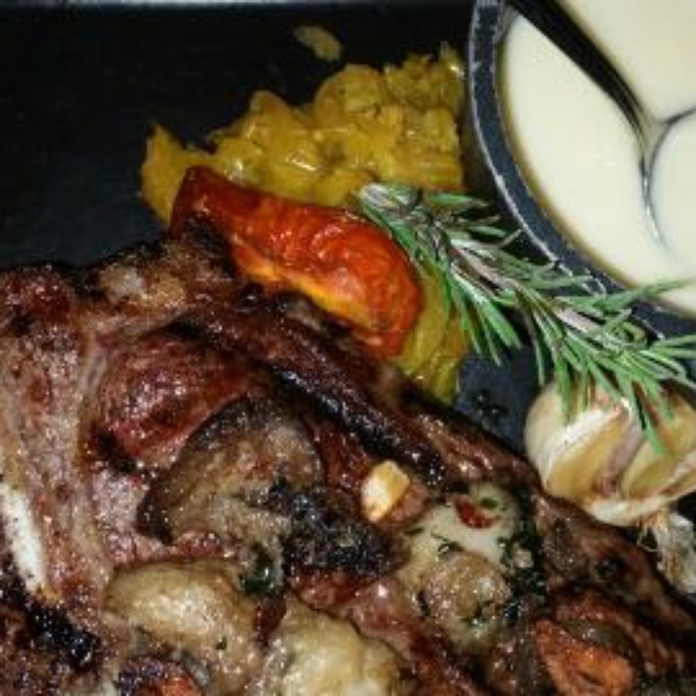 Dawson's - rib eye steak with bone marrow crust and a side of buerre monte. - Steakhouses Near Me - Sacramento, California Dawson's - rib eye steak with bone marrow crust and a side of buerre monte. - Steakhouses Near Me - Sacramento, California