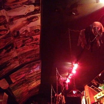 Kozy Kar - Wall art complimented with bras hanging from the light fixtures. - Lounges Near Me - San Francisco, California