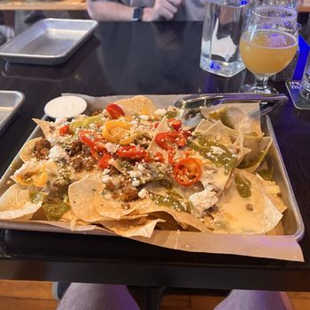 Big Mill - Housemade Chorizo Nachos with sour cream ots - Pizza Near Me - Lawrence, Kansas