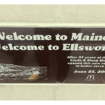 McDonald's - a man standing in front of a welcome sign - Burgers Near Me - Ellsworth, Maine McDonald's - a man standing in front of a welcome sign - Burgers Near Me - Ellsworth, Maine