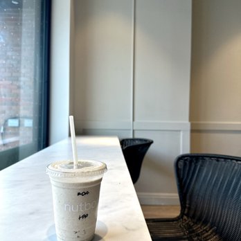 Nutbar - a cup of coffee on a table - Cafes Near Me - Toronto, Ontario Nutbar - a cup of coffee on a table - Cafes Near Me - Toronto, Ontario