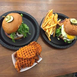 Custom burger with sweet potato fries (so good) and a barnyard burger with regular fries (also so good). Custom burger with sweet potato fries (so good) and a barnyard burger with regular fries (also so good).