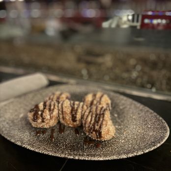 Lamplight Lounge - Seasonal donuts coated with coconut and chocolate - New American Near Me - Anaheim, California