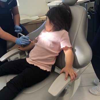 Santa Barbara Children's Dentistry - Showering amber the toothbrush - Pediatric Dentists Near Me - Santa Barbara, California