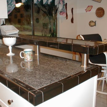 Henderson Bay Construction - a kitchen counter with a coffee cup on it - General Contractors Near Me Henderson Bay Construction - a kitchen counter with a coffee cup on it - General Contractors Near Me