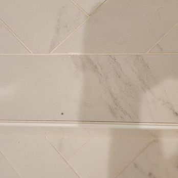 Allied Restoration Services - (Zoomed) The CENTER... FRONT tile has a manufacturing blemish on it. HOW did they choose this tile?????? It can only be spite. - Damage Restoration Near Me - West Covina, California Allied Restoration Services - (Zoomed) The CENTER... FRONT tile has a manufacturing blemish on it. HOW did they choose this tile?????? It can only be spite. - Damage Restoration Near Me - West Covina, California