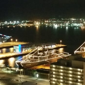 The Embarcadero - Japanese Training Vessels lit up at night.USS Midway also lit up w colors on left. - Local Flavor Near Me - San Diego, California The Embarcadero - Japanese Training Vessels lit up at night.USS Midway also lit up w colors on left. - Local Flavor Near Me - San Diego, California