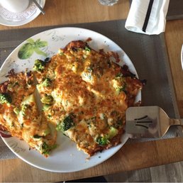 Delicious Tarte topped mushrooms, green onions, broccoli and cheese