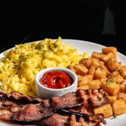 Florenza - Breakfast Bowl: fresh cracked eggs scrambled with cheese, home fries, bacon and toast, served from 8 a.m.