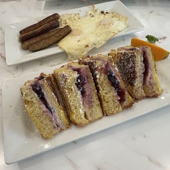 Keke's Breakfast Cafe - Blueberry Stuffed French Toast- made it a combo by adding eggs and sausage. - Breakfast & Brunch Near Me - Hendersonville, Tennessee