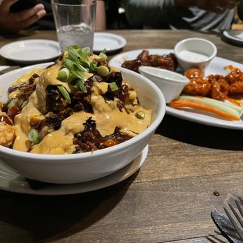 Plank Craft Kitchen & Bar - Pulled pork loaded tots. They are fireeeeee. Get them. Behind is the wings- stick to getting the bone wings. They Aite tho - American Near Me - Folsom, California Plank Craft Kitchen & Bar - Pulled pork loaded tots. They are fireeeeee. Get them. Behind is the wings- stick to getting the bone wings. They Aite tho - American Near Me - Folsom, California