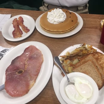 Rick's Cafe - Chocolate Chip pancakes with side of bacon and a two poached egg breakfast with the country ham-lots of food! - Diners Near Me - Virginia Beach, Virginia Rick's Cafe - Chocolate Chip pancakes with side of bacon and a two poached egg breakfast with the country ham-lots of food! - Diners Near Me - Virginia Beach, Virginia